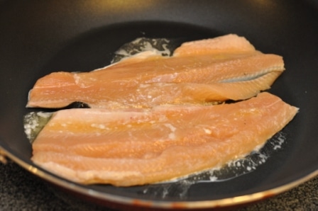 Picture of Pan Seared Fresh Rainbow Trout in Frying Pan Sizzling