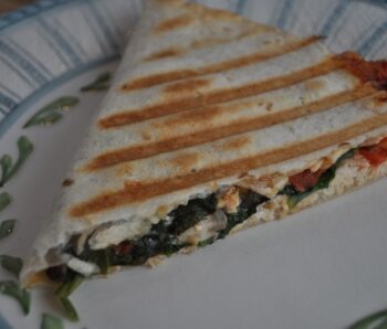 Chicken Quesadilla with spinach and cheese on a plate