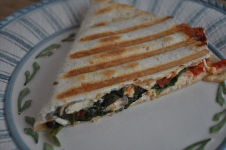 Chicken Quesadilla with spinach and cheese on a plate