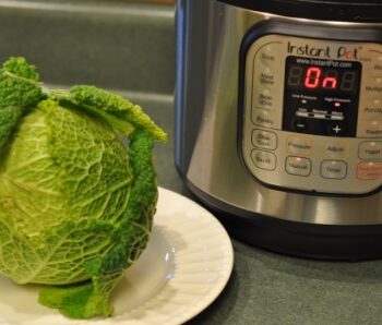 Savoy Cabbage on a plate next to the Instant Pot