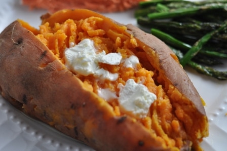 Sweet Potatoes cooked in Instant Pot on a plate with asparagus