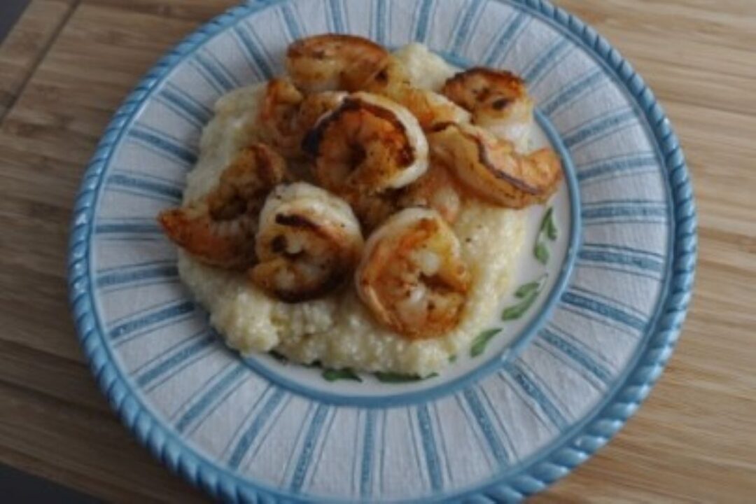 Shrimp and grits on a plate.