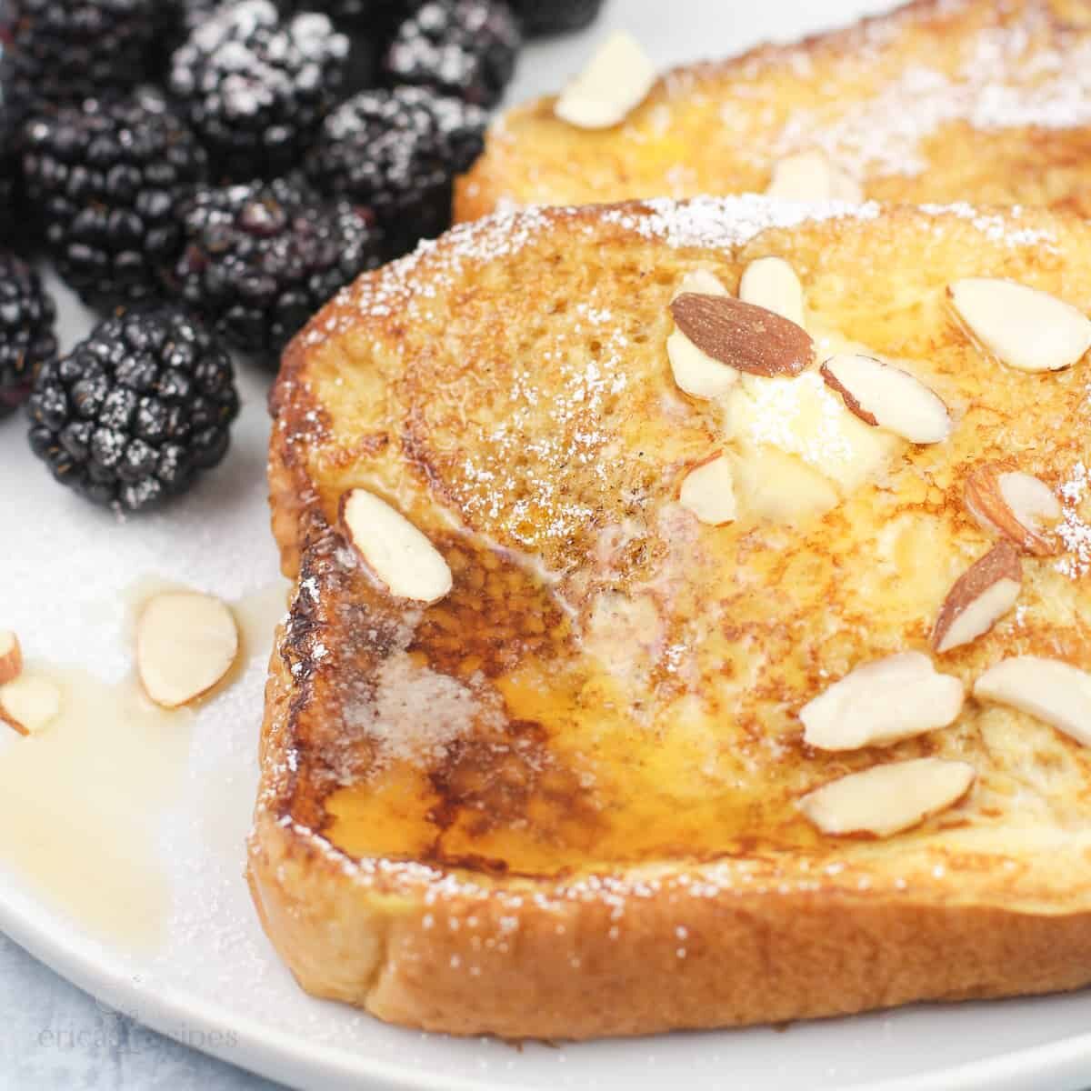 French Toast flavored with amaretto, covered in syrup and topped with sliced almonds.