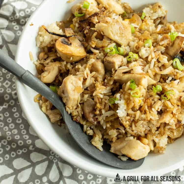 Chicken fried rice on a serving plate.