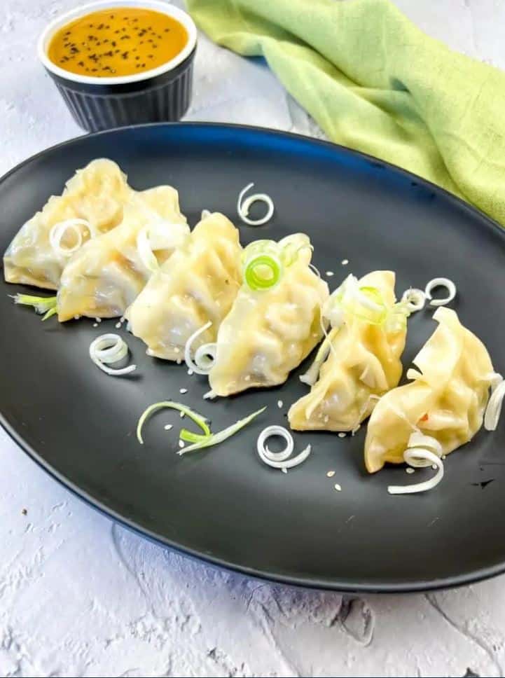 Potstickers on a platter.