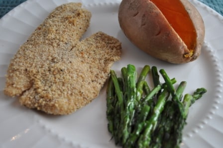 Asparagus served with fish and sweet potato.