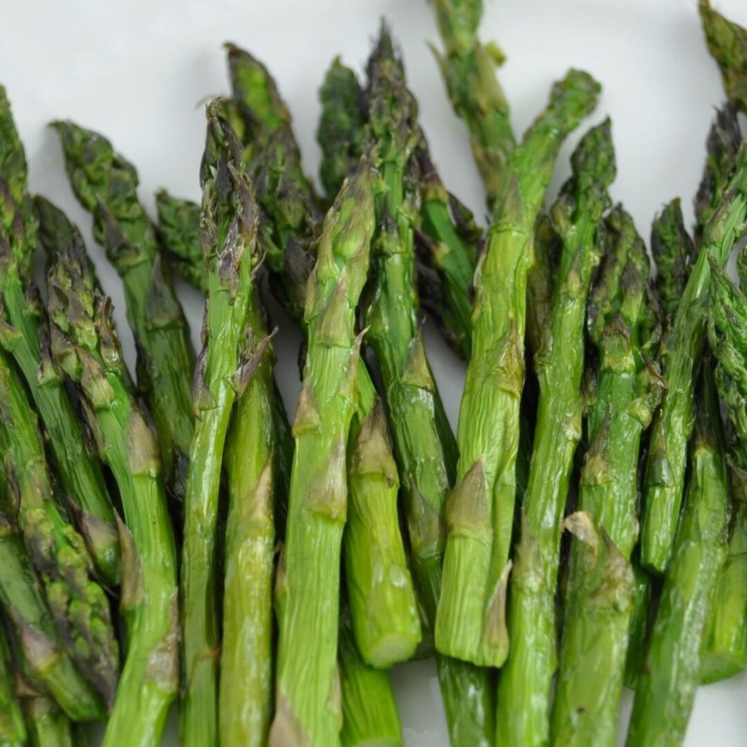 Air fryer asparagus seasoned with olive oil and sea salt.