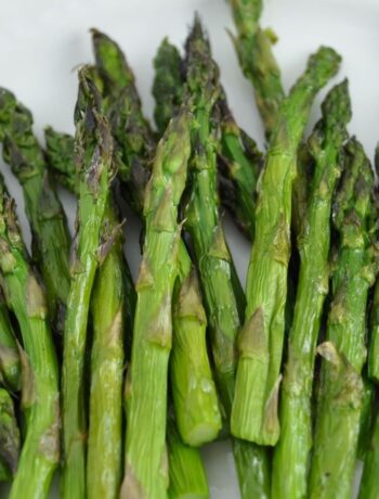 Air fryer asparagus seasoned with olive oil and sea salt.