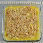 Yellow squash casserole topped with Ritz crackers.